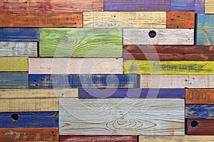 Wall from of horizontal colored painted wooden planks in different colors, surface texture, colorful background