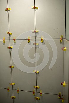 Wall Installation With Tile Spacers in a Modern Setting During a Renovation Project