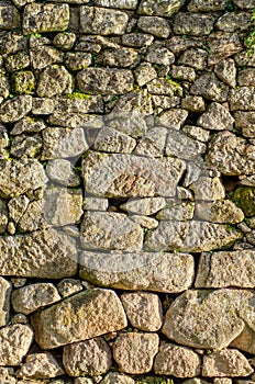 wall of irregular granite stone blocks, texture for backgrounds