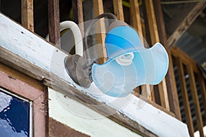 Wall lamp haging on the wooden wall