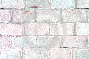 Wall of large bricks with a pink tint. Blank beautiful background.