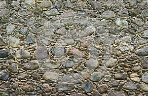 Wall from large granite stones as background