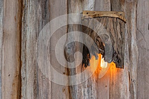 Wall light on old wooden plate
