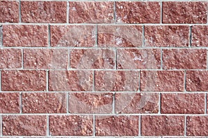 Wall made of decorative bricks. Artificial stone, background.