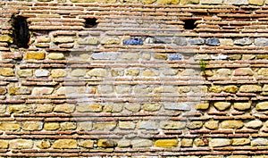 Wall made of stone or brick in the archaeological ruins