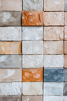 A wall made up of different colored bricks