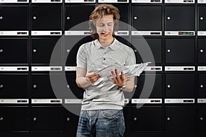 Wall of mailboxes and a postman