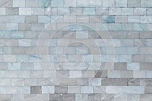 Wall of marble gray-blue tiles. Beautiful stone texture. Empty background.