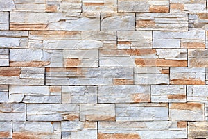 Wall mosaic made of red and beige sandstone tiles