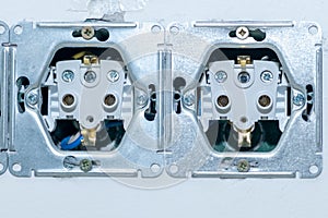Wall-mounted electrical outlet. Close-up