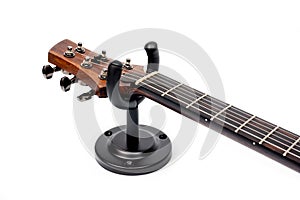 Wall mounted metal holder for acoustic or electric guitar