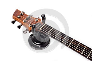 Wall mounted metal holder for acoustic or electric guitar