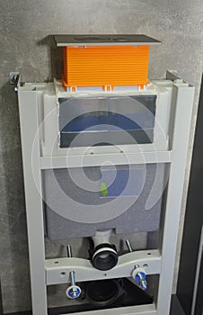 A wall-mounted toilet installation. A concealed toilet frame with a dual flush cistern of a built-in, wall hung toilet