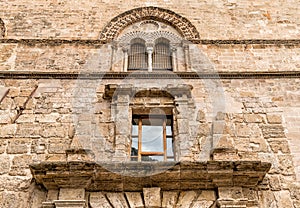 Wall with Mullioned windows with lava stone inlays of the Palace Steri Chiaramonte, Palermo, Sicily, Italy