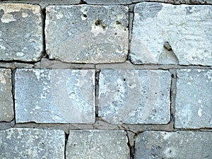 Wall of natural cutted stone blocks, rough texture