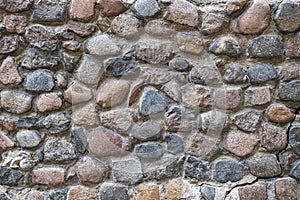wall of natural stone, large boulders and concrete