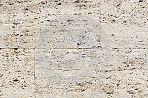 A wall from natural stone travertine