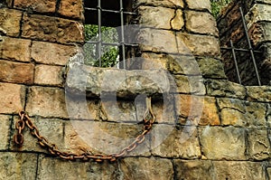 Wall of old brick and lattice on window