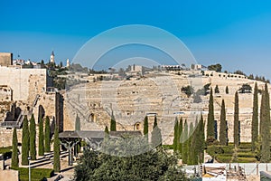 Wall of Old City of Jerusalem with background of Jewish graveyard at the Mount of Olives near the Kidron Valley or King`s Valley