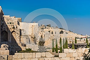 Wall of Old City of Jerusalem with background of Jewish graveyard at the Mount of Olives near the Kidron Valley or King`s Valley