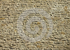 Wall of old, irregular, stones