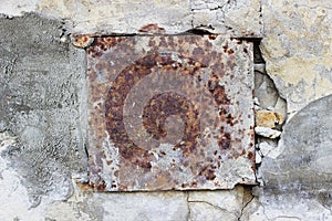 Wall with old metal rusty square background.