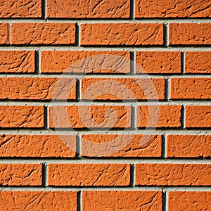 Wall of old red bricks in a pattern with a bevel