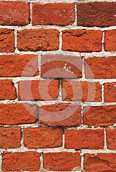 Wall of old red weathered bricks. Old brick wall. Grunge background