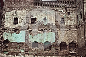 Wall of old ruined brick building