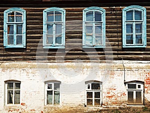 Wall of old russian urban wooden house