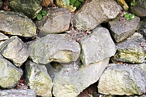 Wall of old stone boulders.