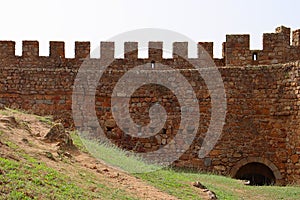 Wall of an old stone castle. Castle of Belver in Portugal.