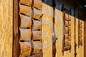 Wall of old style wooden cottage