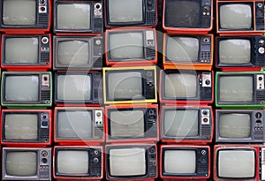 Wall of old vintage televisions