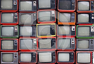 Wall of old vintage televisions photo