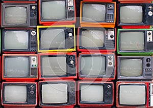 Wall of old vintage televisions photo