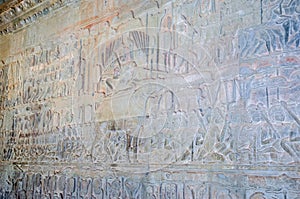 The wall of one of the galleries of Angkor Wat showing episodes from the Hindu epics photo