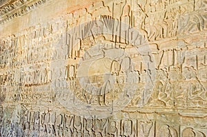 The wall of one of the galleries of Angkor Wat showing episodes from the Hindu epics photo