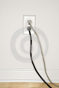 Wall outlet with plugs.