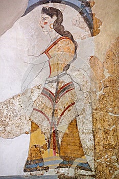 Wall painting of the House of the Ladies depicting a woman from Akrotiri Minoan Settlement, Greece photo