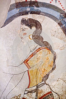 Wall painting of the House of the Ladies depicting a woman from Akrotiri Minoan Settlement, Greece photo