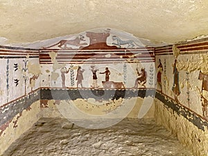 Wall paintings in ancient Etruscan tombs