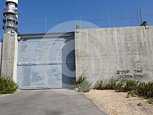 Wall of Palestinian occupation with gate