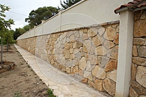 Wall partially lined with natural stone