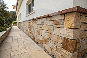 Wall partially lined with natural stone