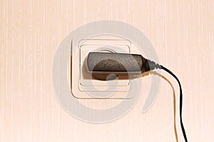 Wall plug with a cable