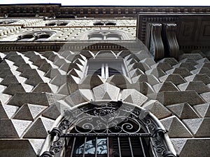 Wall with pyramidal ashlars in Milan. Italy. photo