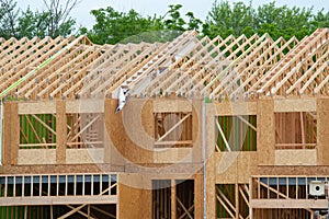 wall and rafters of a plywood house new workplank frame wood