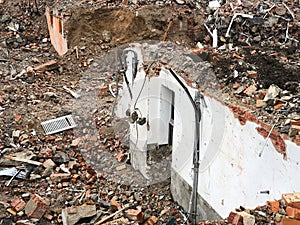 Wall remnants and rubble after house demolition photo