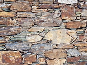 Wall of rocks in andros island greece